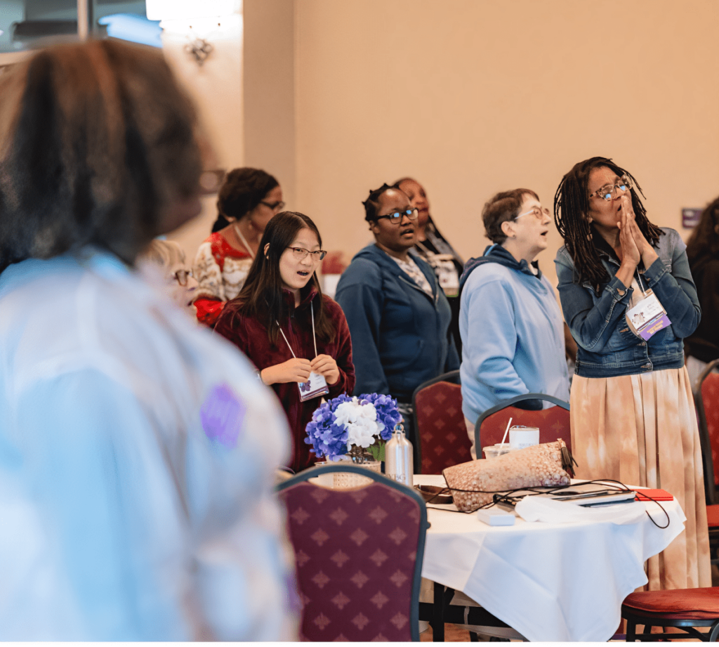 Women of diverse backgrounds engaged in worship and reflection during an American Baptist Women’s Ministries event in Pennsylvania, embodying faith, community, and spiritual empowerment.