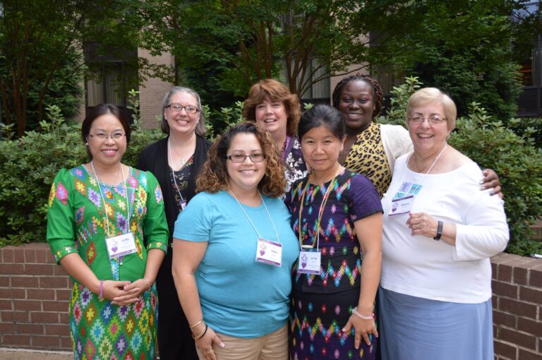 ABWM WOMEN SMILING AND EMBRACING THE ENERGY OF THE GROUP